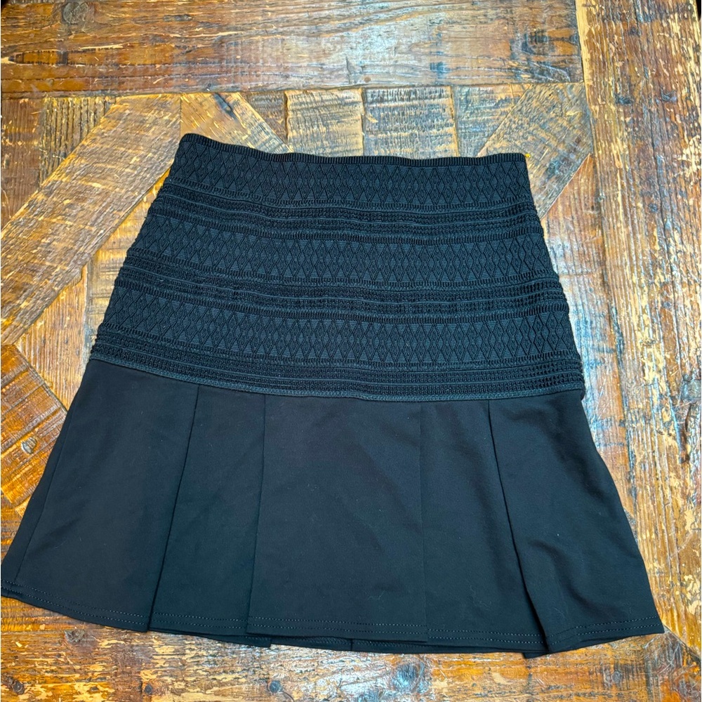 Bebe mini skirt fit and flare black with corset detail on top. Size 2